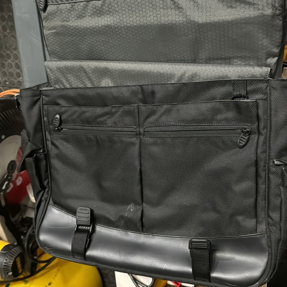 Used Tumi fabric computer bag. The handle has been worn. all the zippers work. - Picture 3 of 5